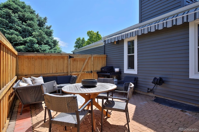 690 W Jamison Cir, Littleton, CO 80120 - view of patio / terrace featuring outdoor dining space, grilling area, and an outdoor hangout area