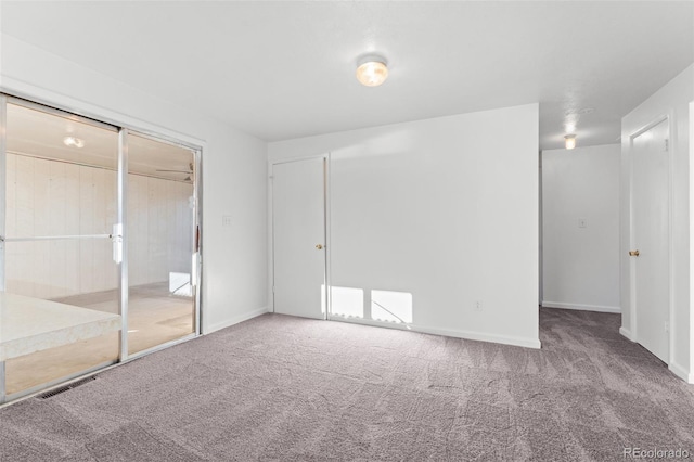 unfurnished bedroom with carpet flooring and a closet