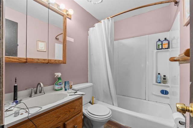 full bathroom with vanity, shower / tub combo, and toilet