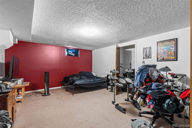 bedroom featuring carpet and a textured ceiling