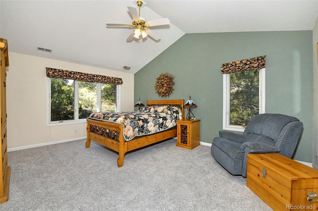 bedroom with visible vents, carpet floors, baseboards, and vaulted ceiling