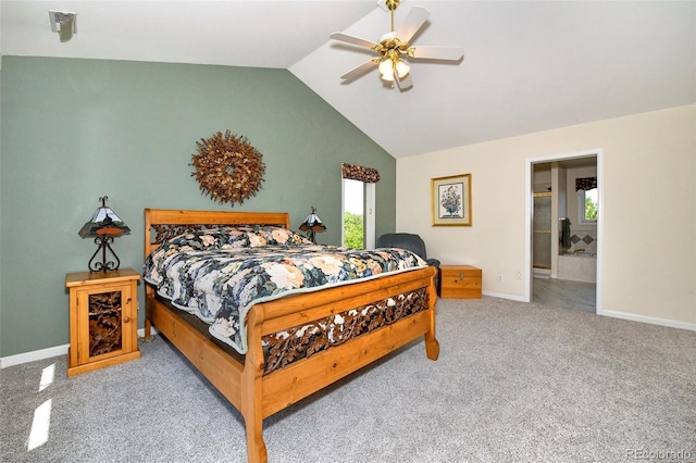 bedroom featuring ensuite bathroom, carpet, baseboards, ceiling fan, and vaulted ceiling