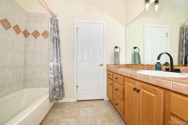 full bath featuring tile patterned flooring, vanity, and shower / tub combo with curtain