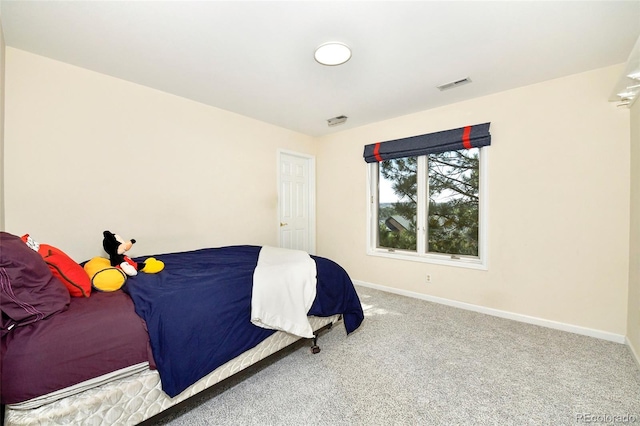 bedroom with visible vents, baseboards, and carpet flooring