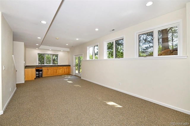 interior space with recessed lighting, visible vents, baseboards, and carpet