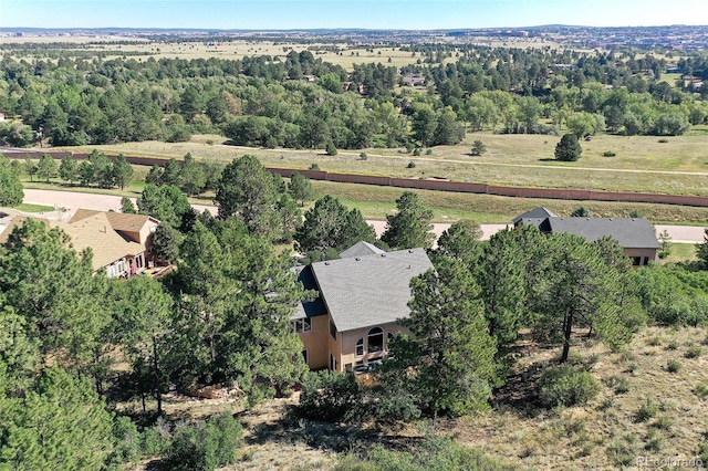 bird's eye view featuring a wooded view