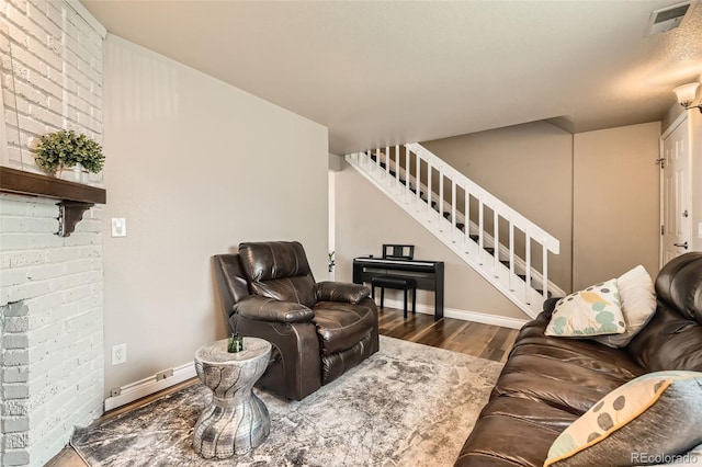 15139 E Wesley Ave, Aurora, CO 80014 - living area with stairs, wood finished floors, and baseboards