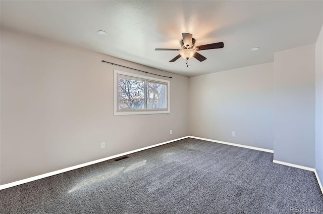 15139 E Wesley Ave, Aurora, CO 80014 - empty room with a ceiling fan, dark carpet, and baseboards