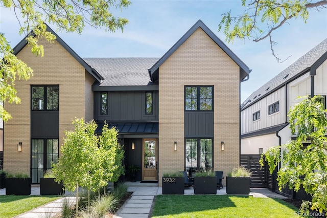 3932 Kalamath St, Denver, CO 80211 - view of front of property with board and batten siding, brick siding, a standing seam roof, and a shingled roof