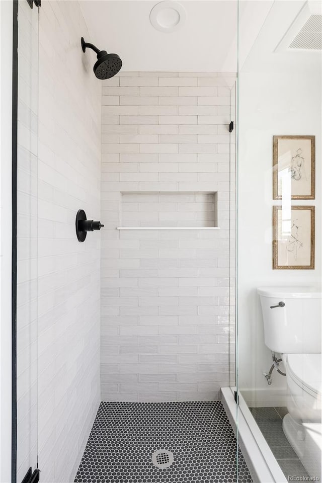 3932 Kalamath St, Denver, CO 80211 - bathroom with a shower stall, toilet, and tile patterned floors