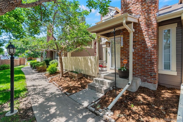 2092 S Helena St Unit C, Aurora, CO 80013 - doorway to property featuring covered porch and brick siding