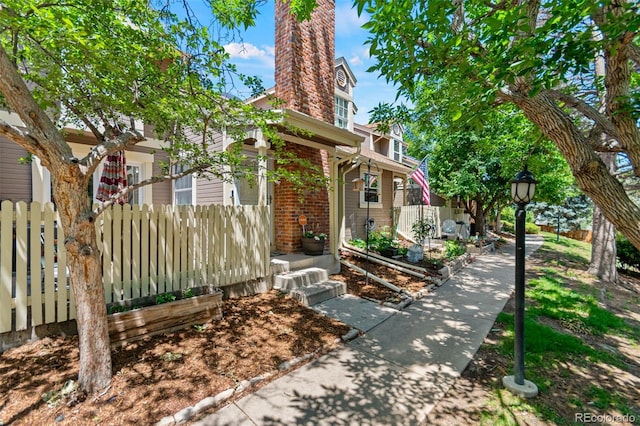 2092 S Helena St Unit C, Aurora, CO 80013 - view of front of property featuring a chimney and brick siding