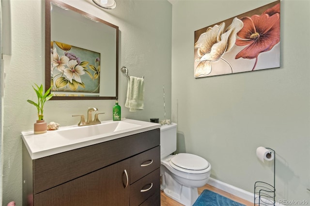 2092 S Helena St Unit C, Aurora, CO 80013 - half bathroom with vanity and wood finished floors