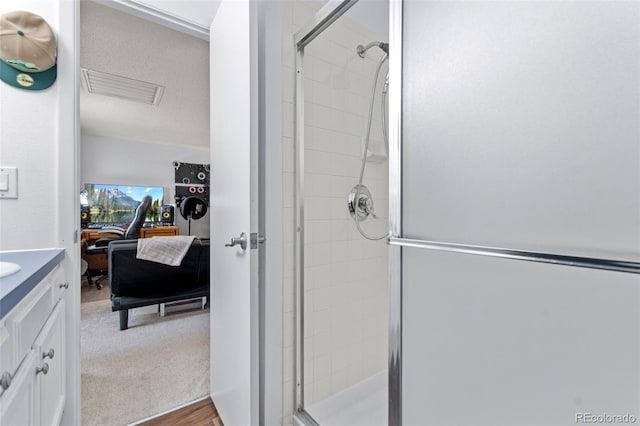 2092 S Helena St Unit C, Aurora, CO 80013 - full bathroom with a stall shower, vanity, and wood finished floors