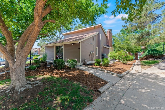 2092 S Helena St Unit C, Aurora, CO 80013 - mid-century modern home featuring a chimney