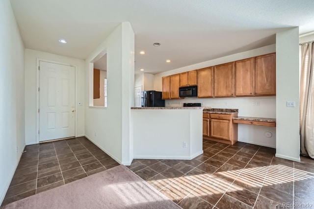 kitchen featuring black appliances, recessed lighting, brown cabinets, and baseboards