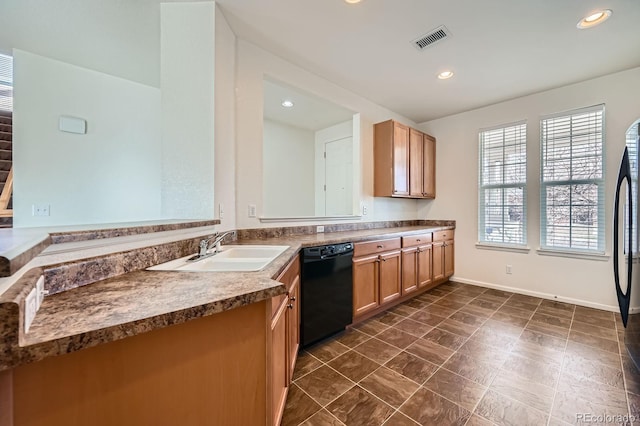 kitchen with baseboards, visible vents, recessed lighting, a sink, and dishwasher