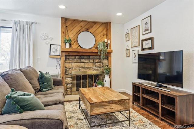 living room featuring hardwood / wood-style floors and a fireplace