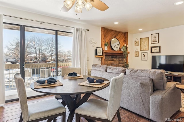 dining area with dark hardwood / wood-style floors and ceiling fan