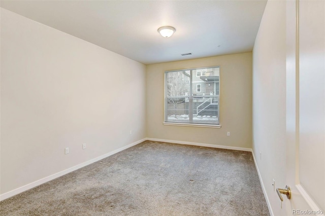 spare room with carpet floors