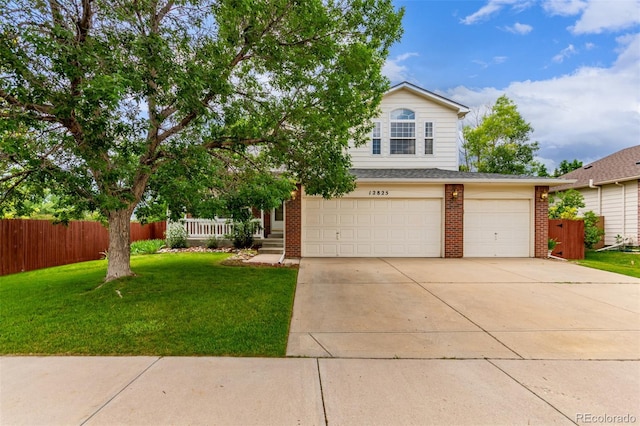 12825 Forest Way, Thornton, CO 80241 - view of front of property featuring brick siding, an attached garage, and concrete driveway