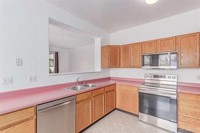 12825 Forest Way, Thornton, CO 80241 - kitchen with stainless steel appliances, light countertops, and light floors