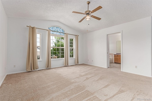 12825 Forest Way, Thornton, CO 80241 - unfurnished room featuring lofted ceiling, ceiling fan, carpet flooring, and a textured ceiling