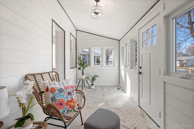 sunroom with vaulted ceiling