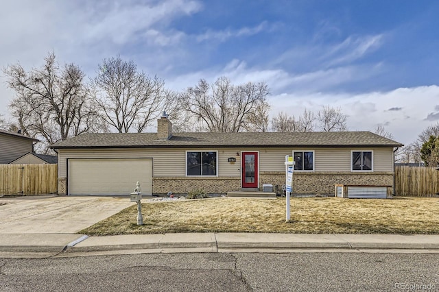 ranch-style house with a garage, driveway, fence, and brick siding