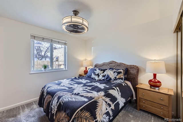 bedroom with carpet and baseboards