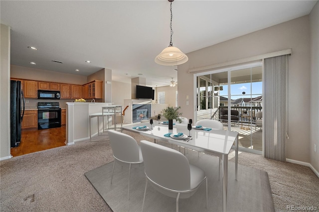 carpeted dining area with baseboards, recessed lighting, and ceiling fan