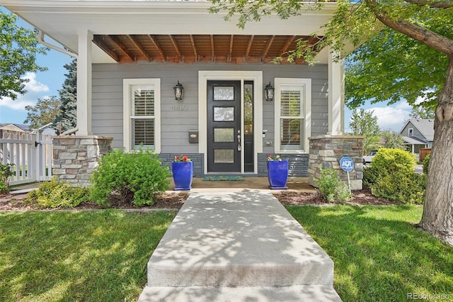 4603 W 33rd Ave, Denver, CO 80212 - entrance to property featuring covered porch and stone siding