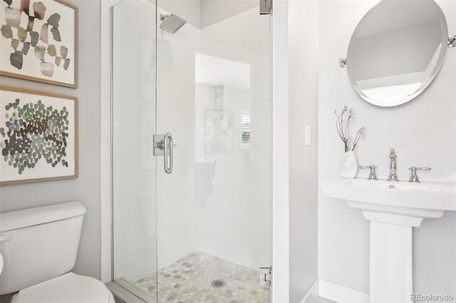 4603 W 33rd Ave, Denver, CO 80212 - bathroom featuring toilet, a stall shower, and a sink