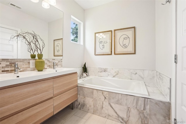4603 W 33rd Ave, Denver, CO 80212 - bathroom with double vanity, a garden tub, backsplash, and tile patterned flooring