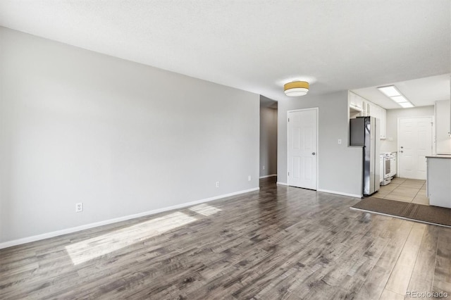 unfurnished living room featuring light hardwood / wood-style flooring