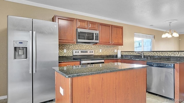 kitchen featuring sink, tasteful backsplash, a center island, ornamental molding, and appliances with stainless steel finishes