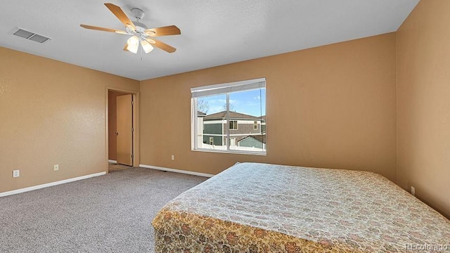 bedroom with ceiling fan and carpet