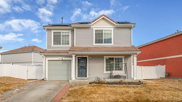 view of property with a garage, a porch, a front lawn, and solar panels