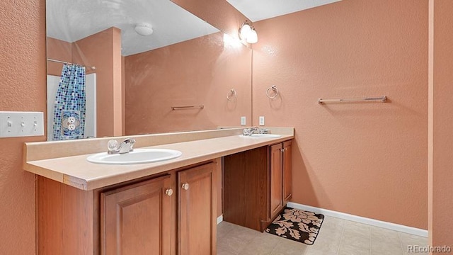 bathroom featuring vanity and a shower with shower curtain