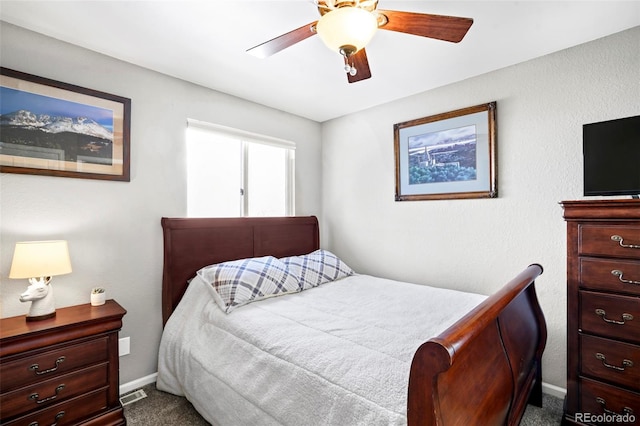 bedroom with carpet floors, ceiling fan, and baseboards