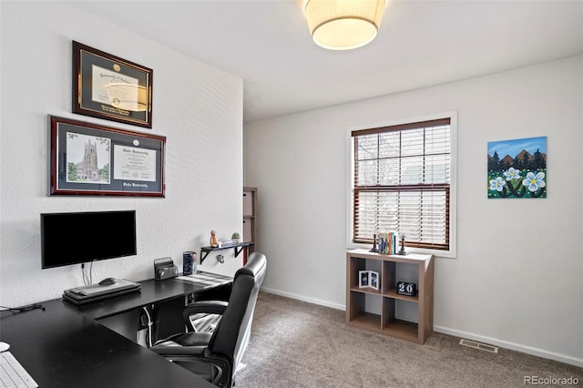 office area with carpet, visible vents, and baseboards