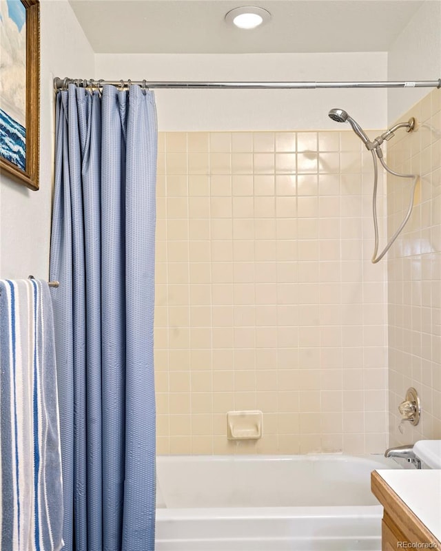 full bath featuring shower / tub combo and vanity