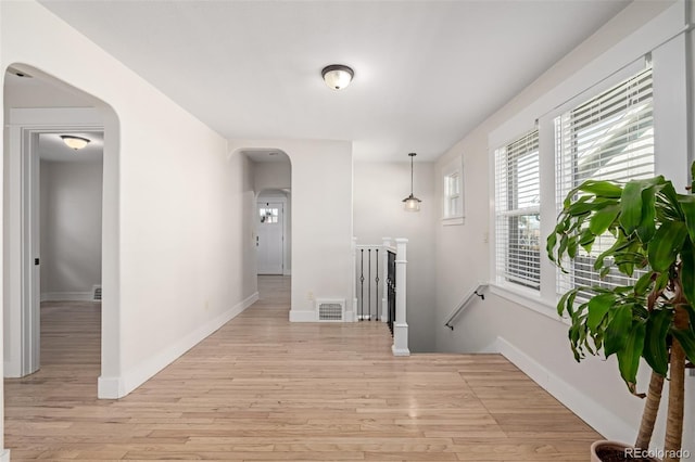 hall with light wood-type flooring