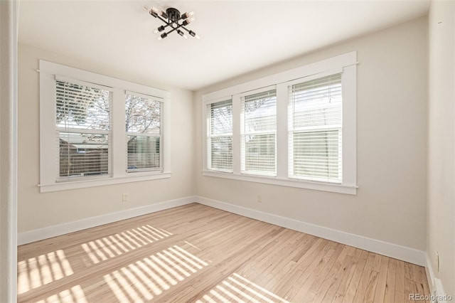 unfurnished room with light hardwood / wood-style floors