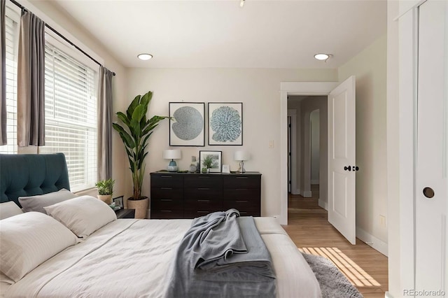 bedroom with light hardwood / wood-style flooring