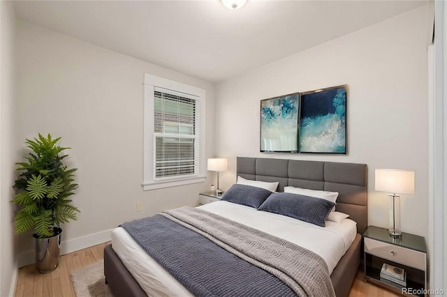 bedroom with light hardwood / wood-style flooring