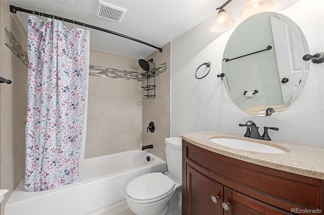 full bathroom featuring vanity, toilet, shower / tub combo, and a textured ceiling