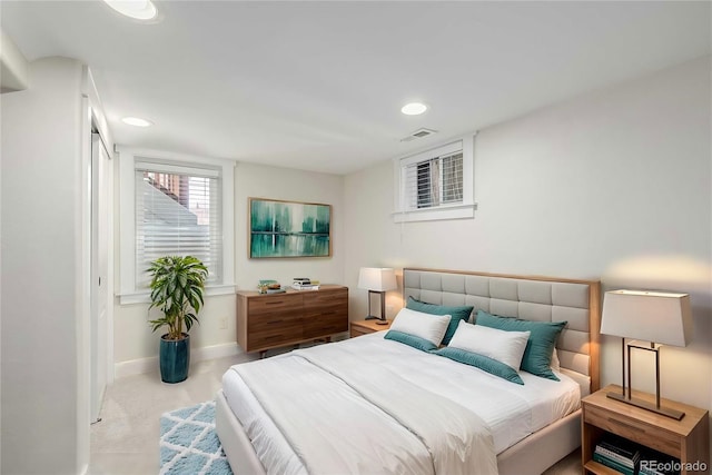 bedroom featuring light carpet