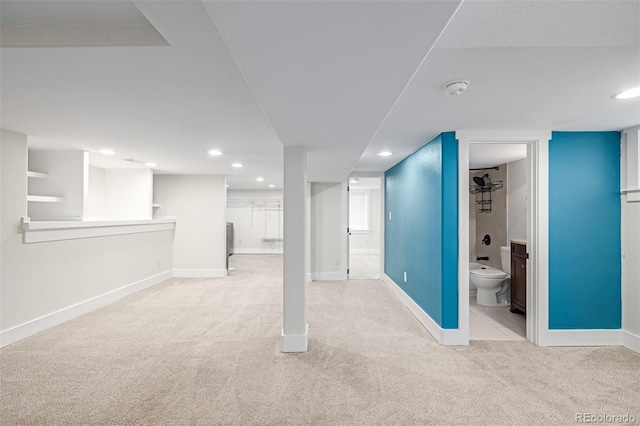 basement featuring light carpet