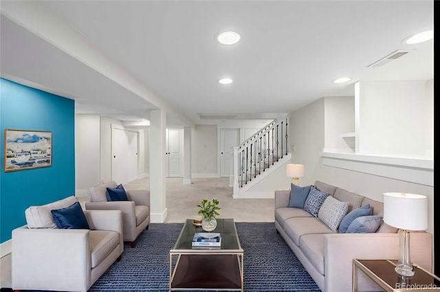 carpeted living room with stairway, baseboards, visible vents, and recessed lighting